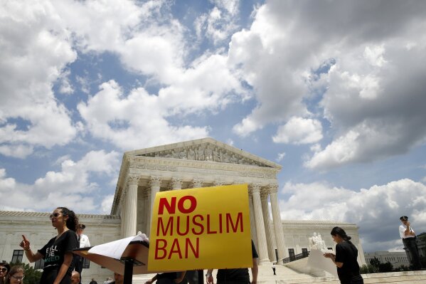 High court OKs Trump s travel ban rejects Muslim bias claim AP News